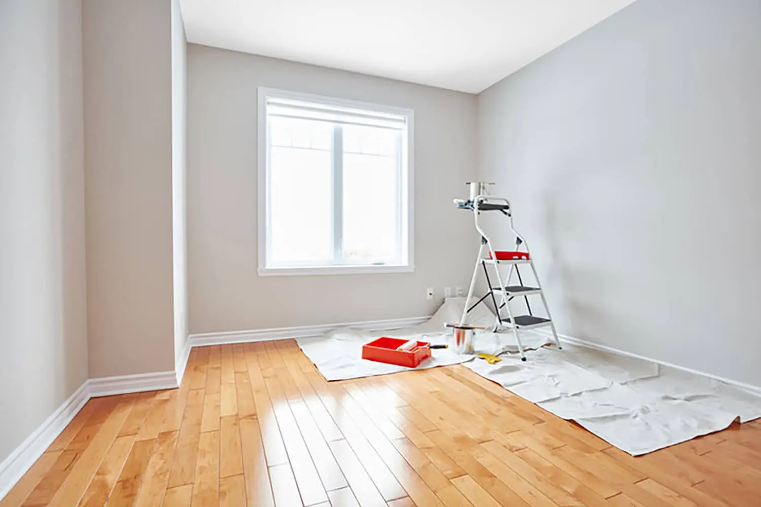 how interior painting changes a space with fresh neutral wall paint in a bright room during an interior painting project