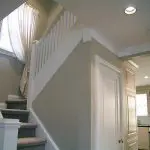 Interior home staircase and walls prepared during painting project showing how professional painters protect your home during interior painting
