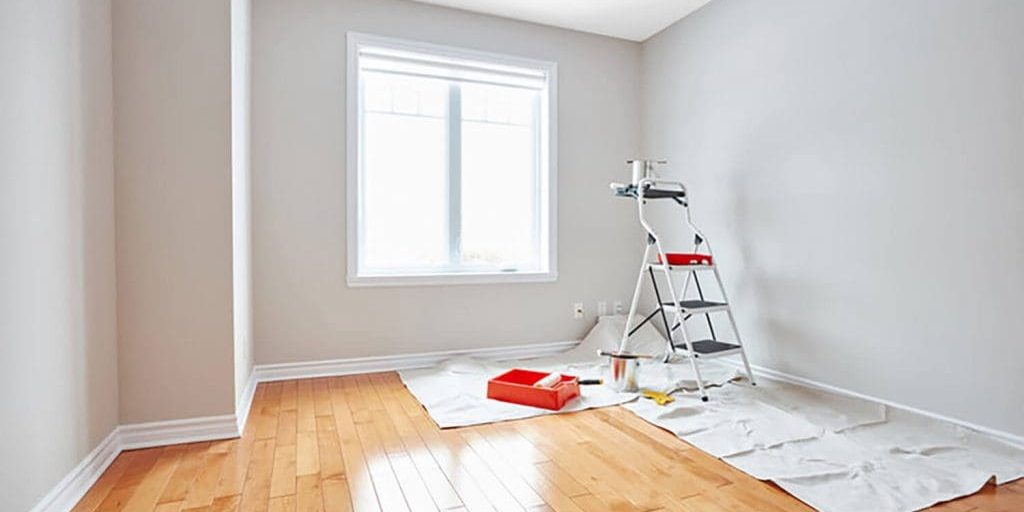 how interior painting changes a space with fresh neutral wall paint in a bright room during an interior painting project